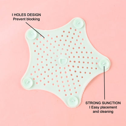 Mint green silicone star-shaped sink filter by Wukusy, designed to catch hair and debris in bathroom drain strainers.