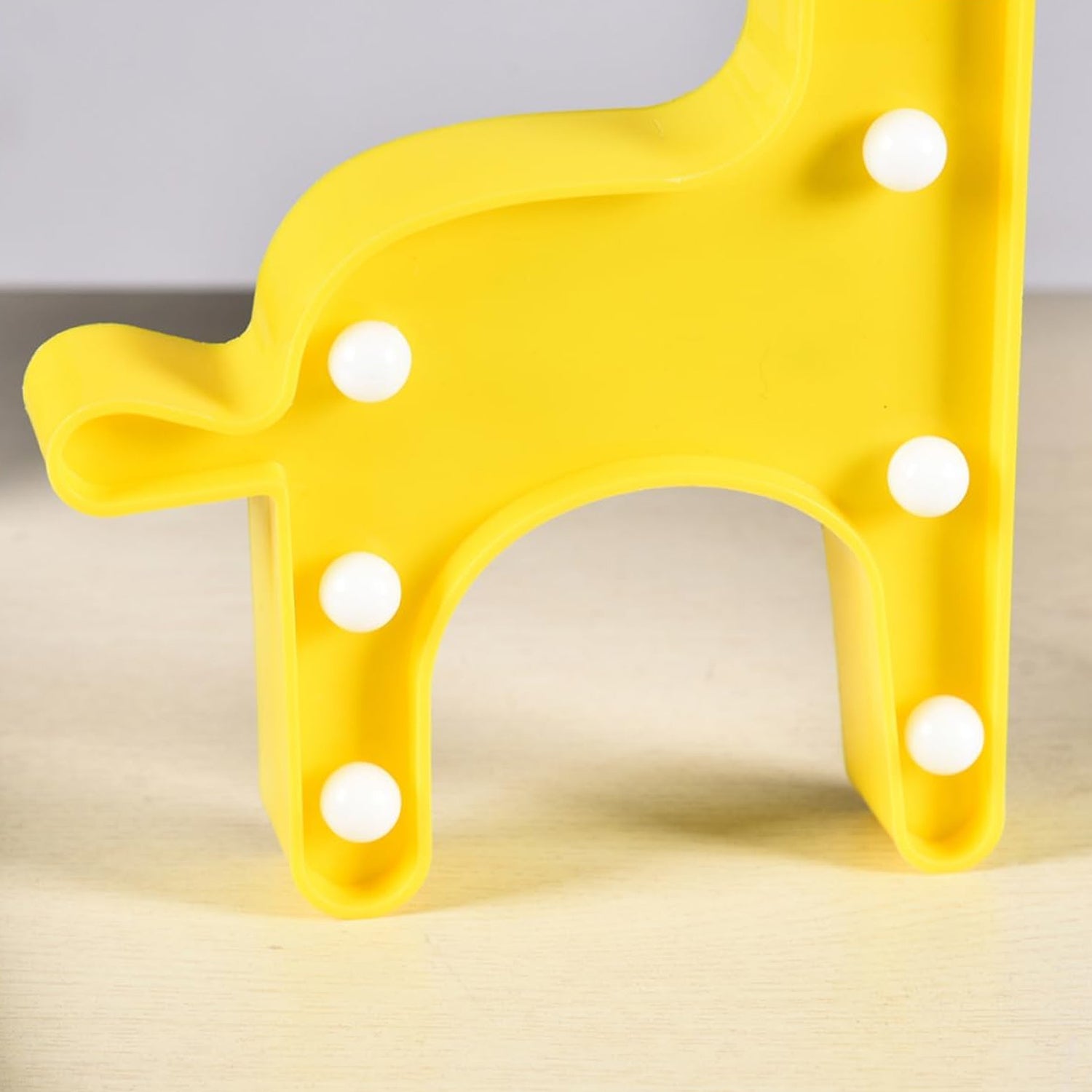 Giraffe-shaped LED decorative night light by Wukusy, perfect for home decor and ambient lighting in a child's room.