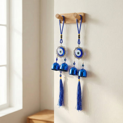 Decorative evil eye hanging wind chime set with two colorful glass charms and metal bells, designed for home decor and protection.