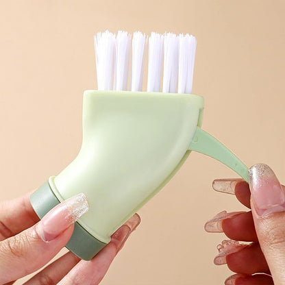 Wukusy multipurpose cleaning brush with connectable design and built-in scraper, suitable for kitchen and household cleaning tasks.