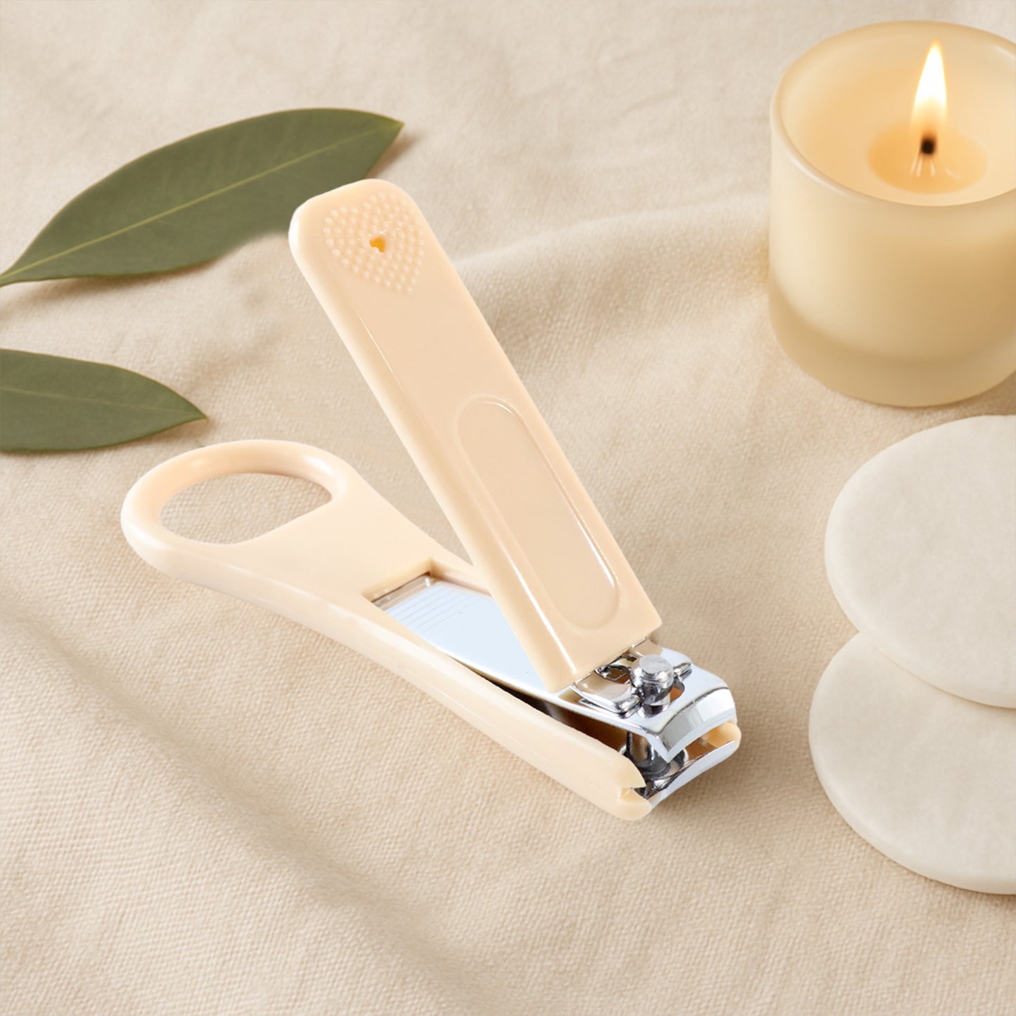 Wukusy ergonomic ring-handle nail clipper with a curved cutting edge for precise grooming, placed on a white background.
