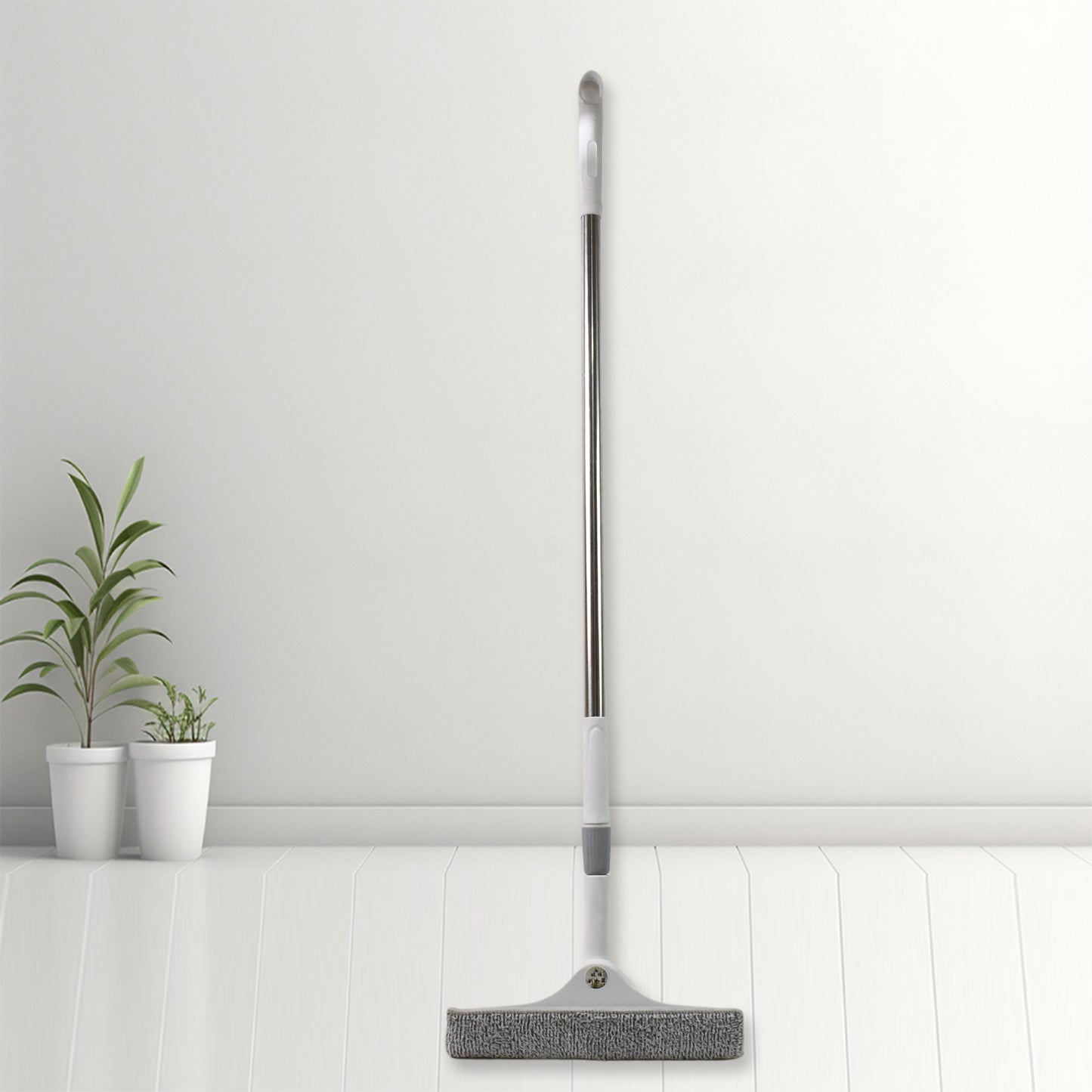 Set of four Wukusy dustpan and squeegee cleaning tools including broom brushes for kitchen and window cleaning.