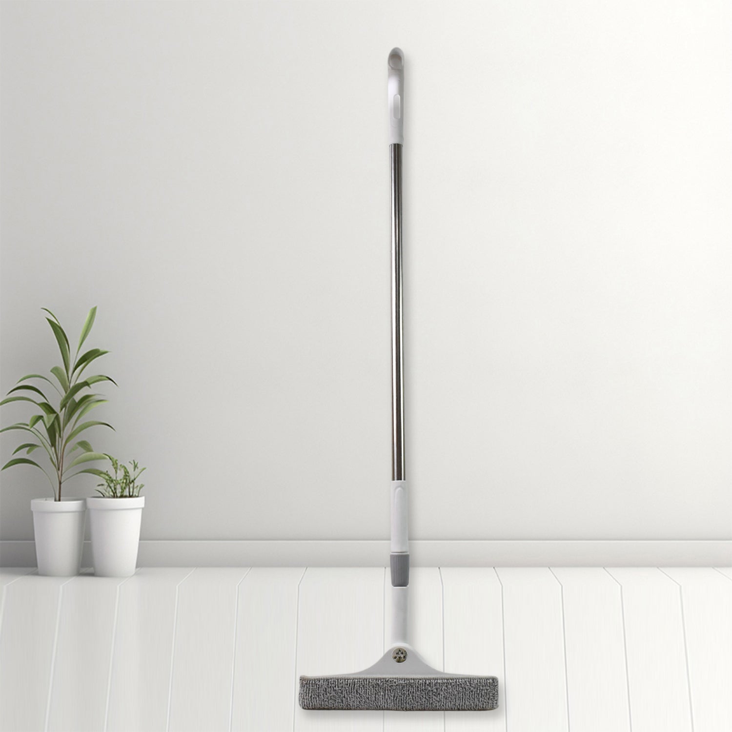 Set of four Wukusy dustpan and squeegee cleaning tools including broom brushes for kitchen and window cleaning.