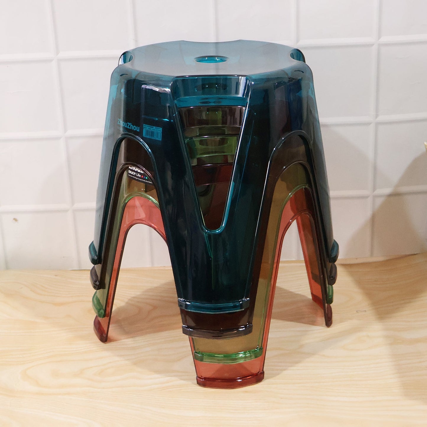 Set of four Wukusy transparent plastic sitting stools, 28x26cm, sturdy indoor and outdoor seats with modern design.