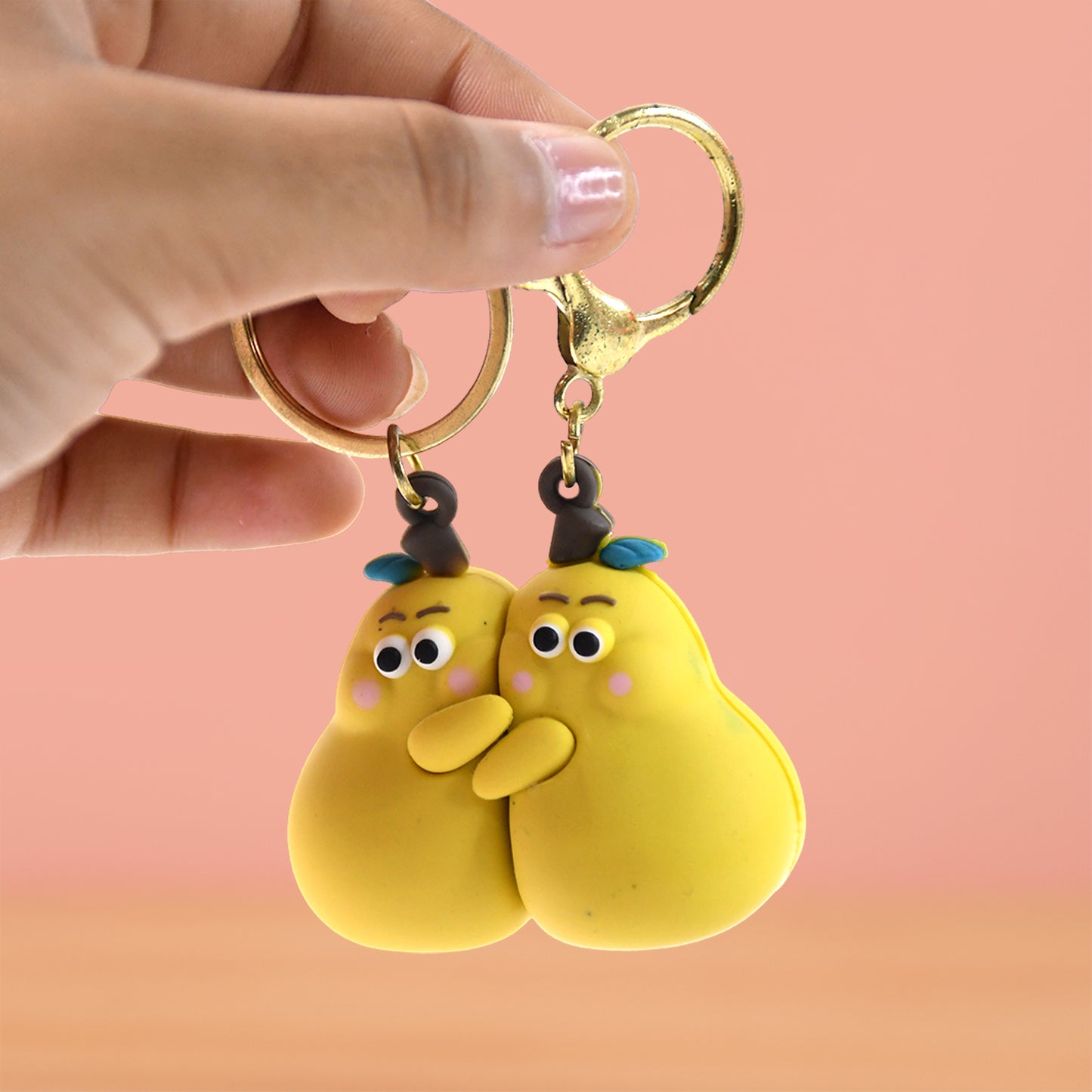 Wukusy 2-in-1 Cute Cartoon Couple Keychain featuring playful toy figures with colorful designs and detailed character expressions.