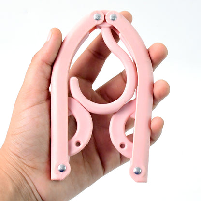 Portable Wukusy travel hanger, folding clothes hanger for travel and organization, shown unfolded with clothing hanging.