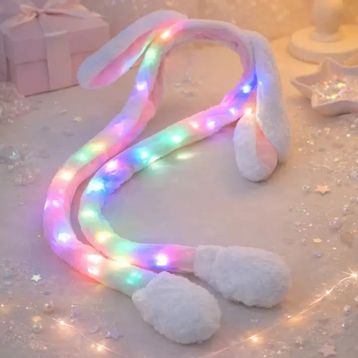 Cartoon glowing rabbit hat by Ekom featuring plush bunny ears, LED light, and moving flaps in a random color for toys and games.