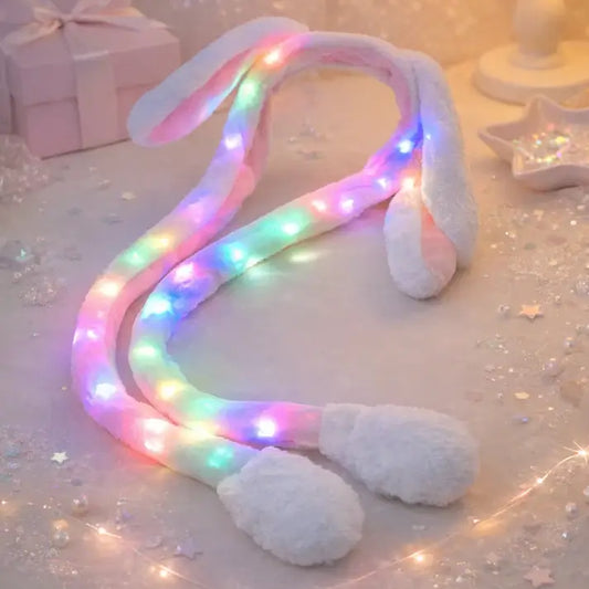 Cartoon glowing rabbit hat by Ekom featuring plush bunny ears, LED light, and moving flaps in a random color for toys and games.