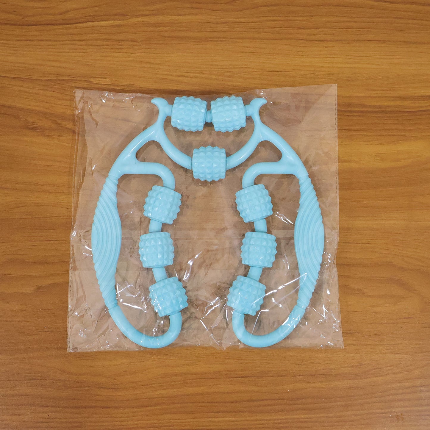 Wukusy handheld body massage roller for legs and arms, designed for muscle relaxation and pain relief.