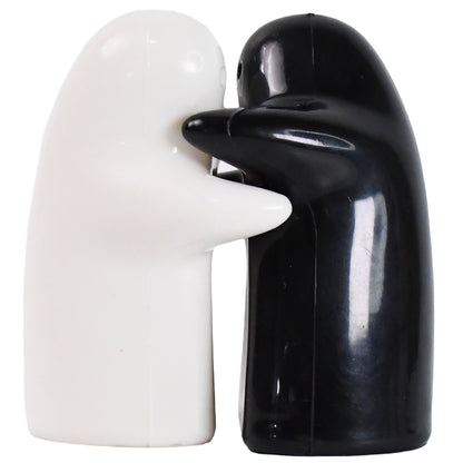 Wukusy ceramic salt and pepper shakers set with cute design, 2-piece spice seasoning shakers for kitchen use.