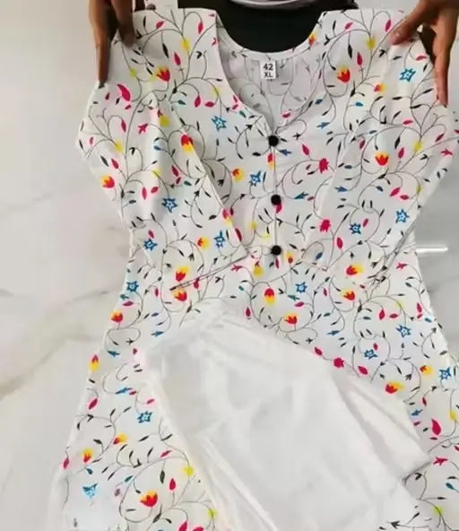 White printed women's cotton kurta set with matching pants and dupatta, featuring traditional design and comfortable fit from Ekom.