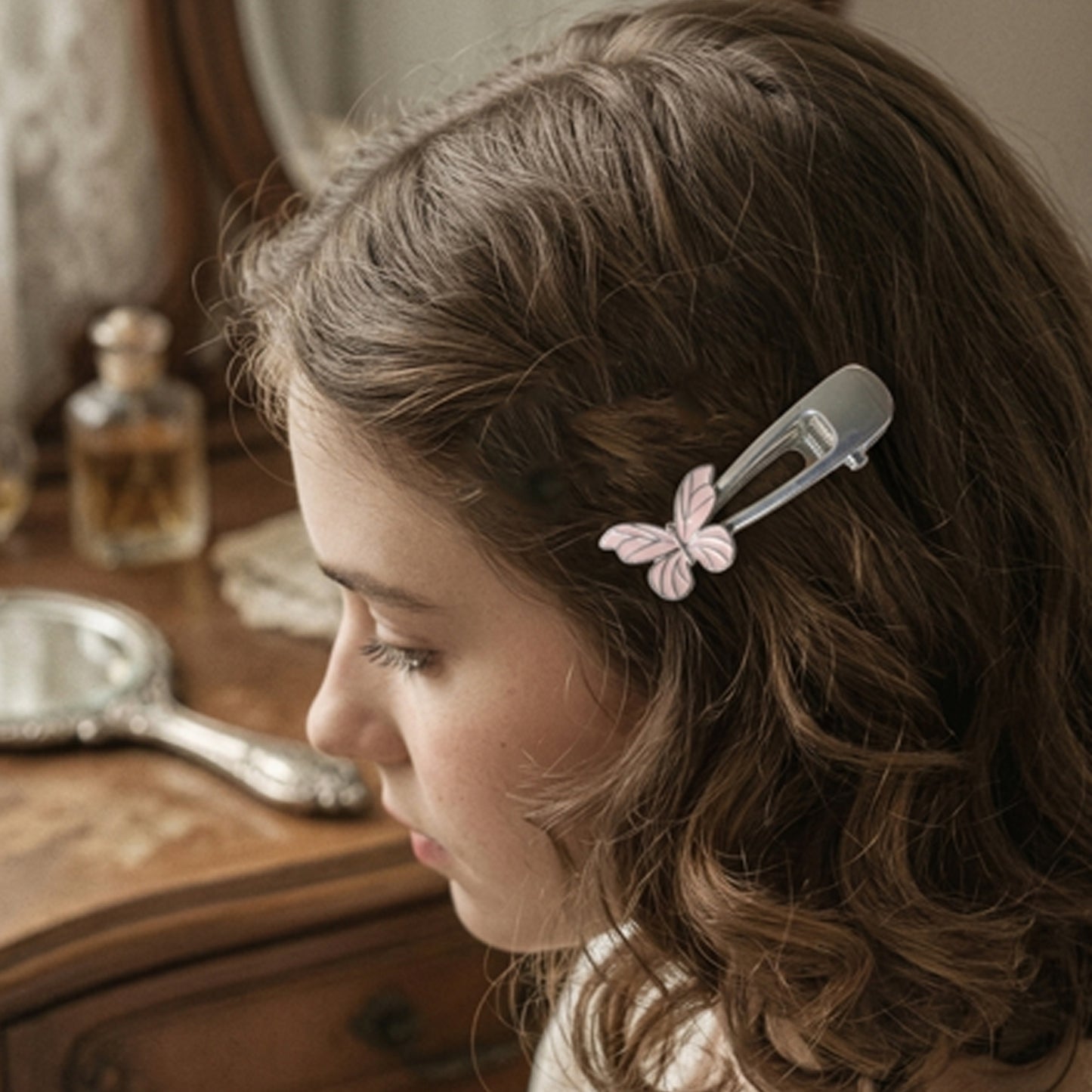 Metal hair clip with butterfly design by Wukusy, featuring a sleek silver finish and decorative butterfly shape.