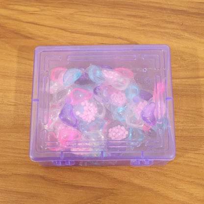 Set of 10 multicolour laundry detergent pods by Wukusy, showcasing vibrant gel capsules in a clear container.