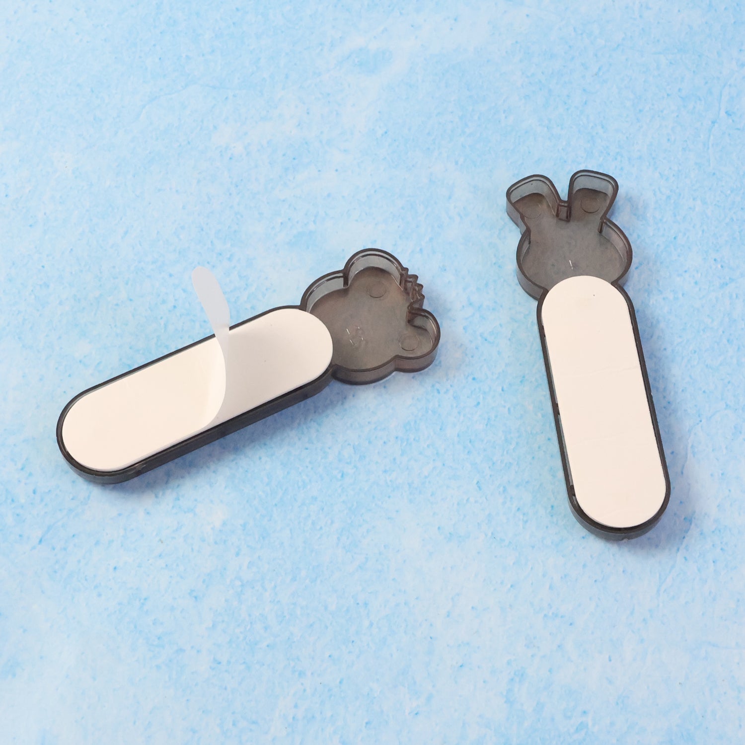 Wukusy Self Stick Push Pull Helper tool set, 2-piece for home and kitchen use, showing the adhesive pads and handles in use.