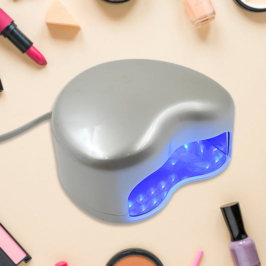 Wukusy LED UV nail dryer and curing lamp for gel nails, compact health care device for fast nail curing, front view.