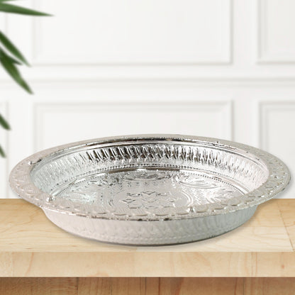 Silver finish plastic pooja thali for home worship, featuring traditional design suitable for religious ceremonies.