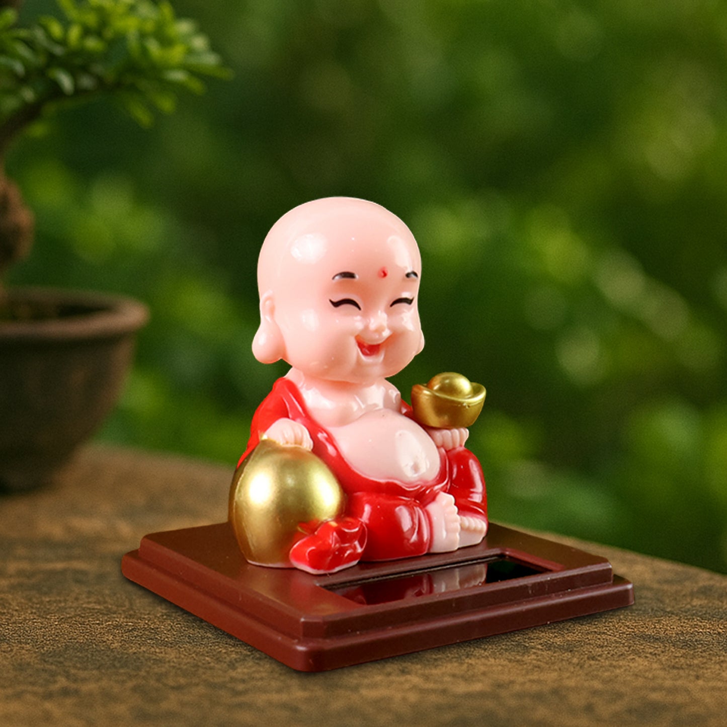Wukusy solar-powered moving head Buddha car ornament in mixed colors, designed for automotive decoration and spiritual appeal.