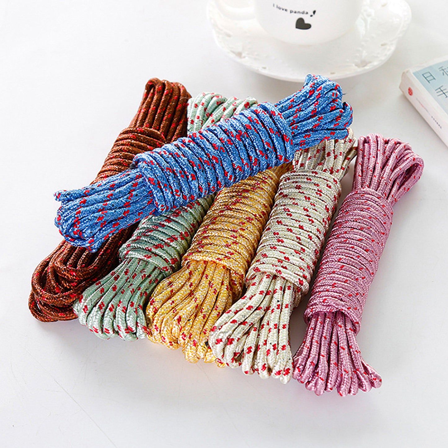 Wukusy 10-meter heavy-duty nylon laundry clothesline rope for outdoor camping or indoor use, sturdy and portable for drying or crafts.
