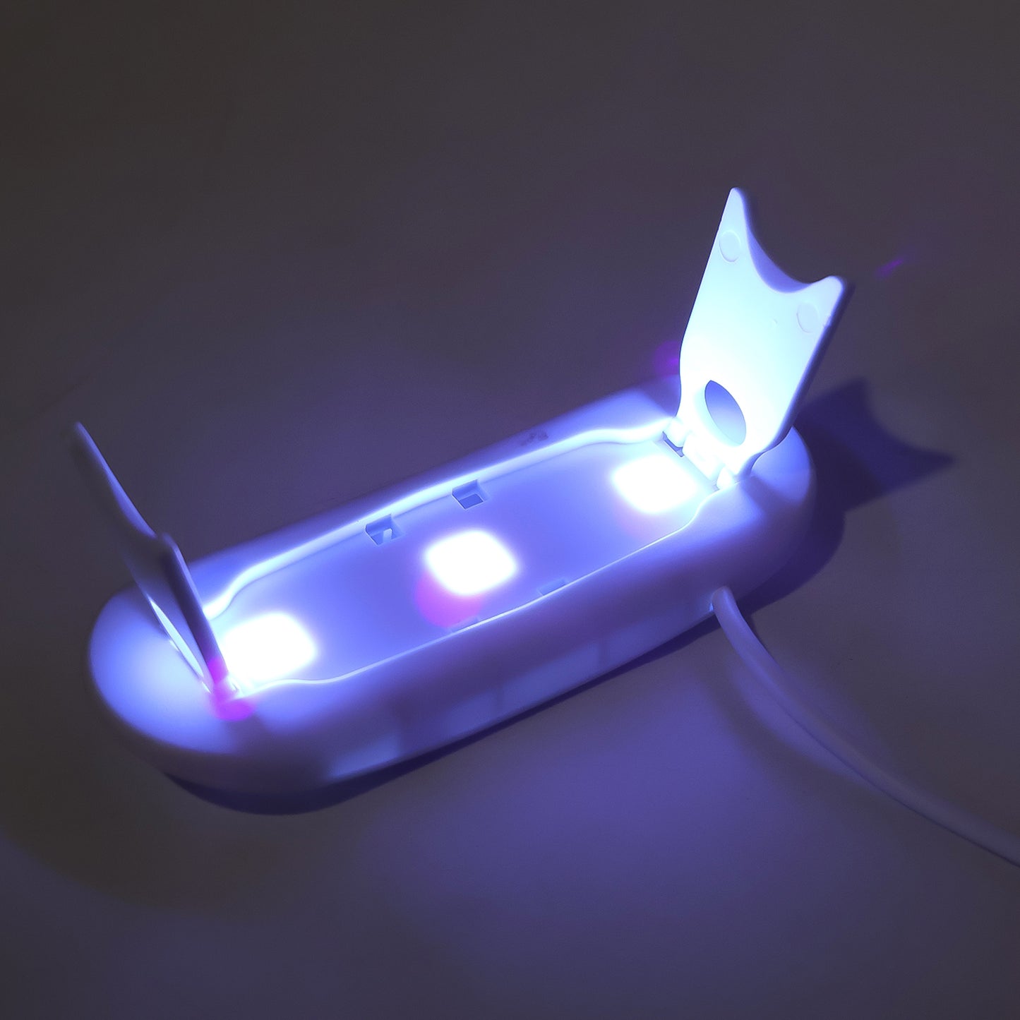 Wukusy mini portable UV LED nail lamp for gel nail polish curing, compact and stylish for quick at-home nail drying.