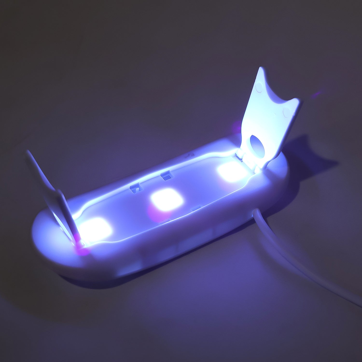 Wukusy mini portable UV LED nail lamp for gel nail polish curing, compact and stylish for quick at-home nail drying.