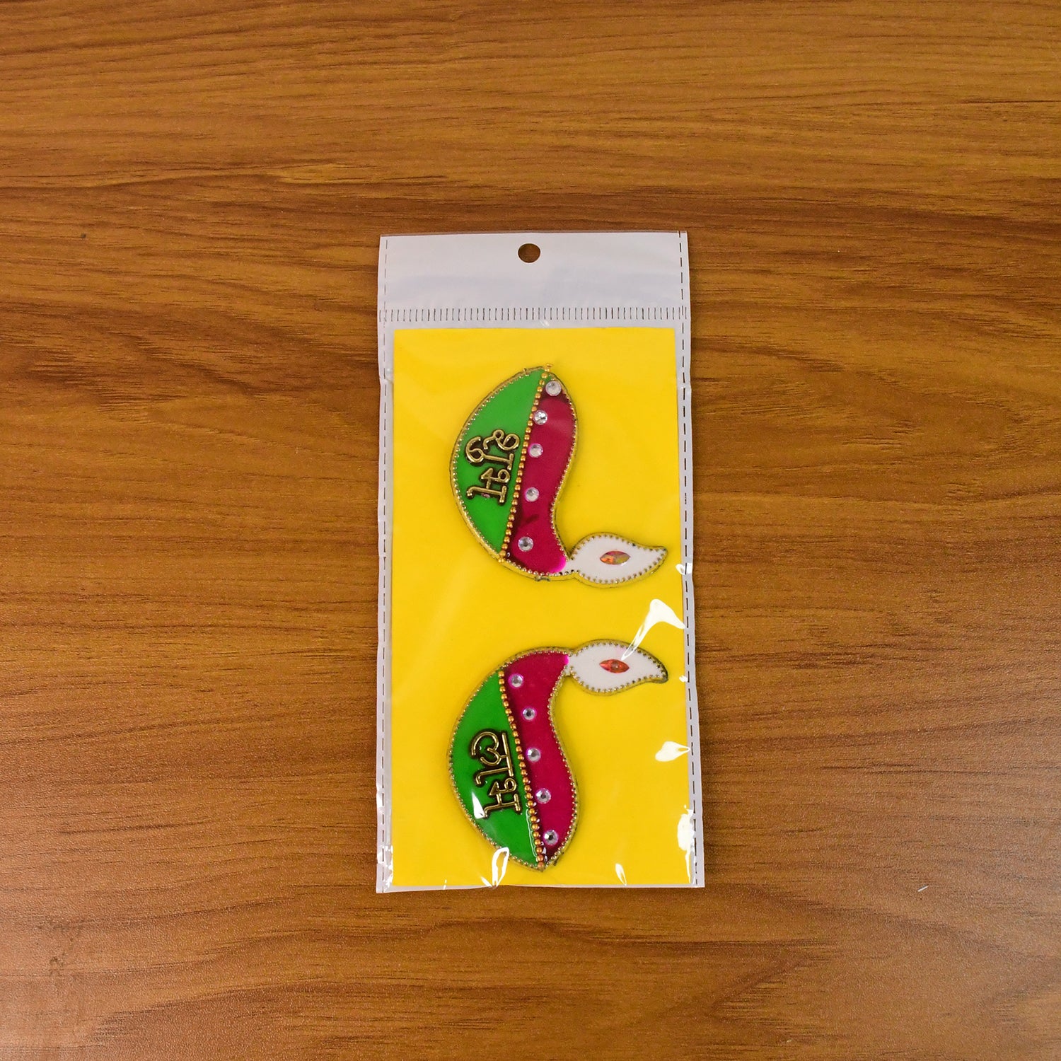 Two Wukusy Shubh Labh Diya-shaped wall hangings for home decor, featuring intricate designs and traditional diya motifs.