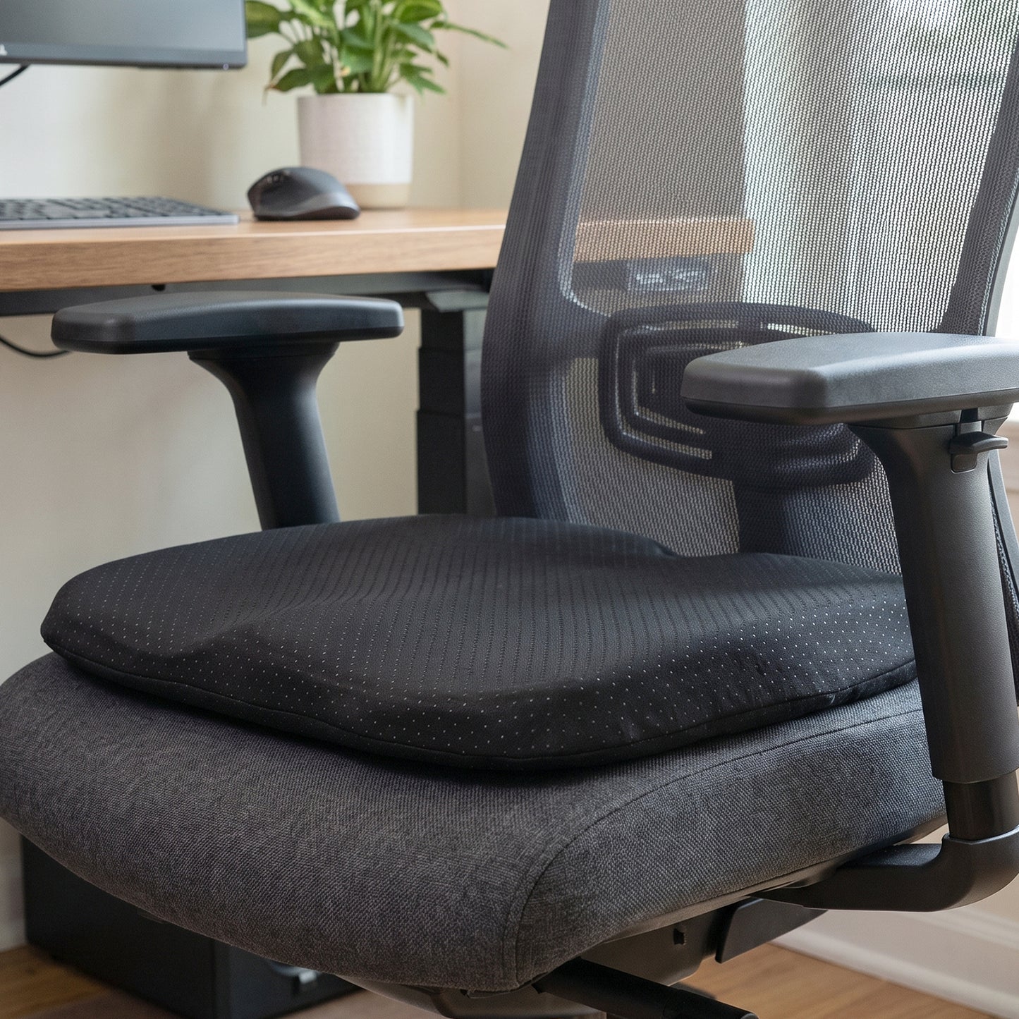 Wukusy ergonomic egg-shaped memory foam cushion for office and car seats, providing comfort and support during sitting.