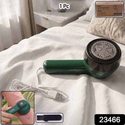 Wukusy USB-powered fabric lint remover with a handle, designed to clean fuzz and lint from sweaters and fabric surfaces.