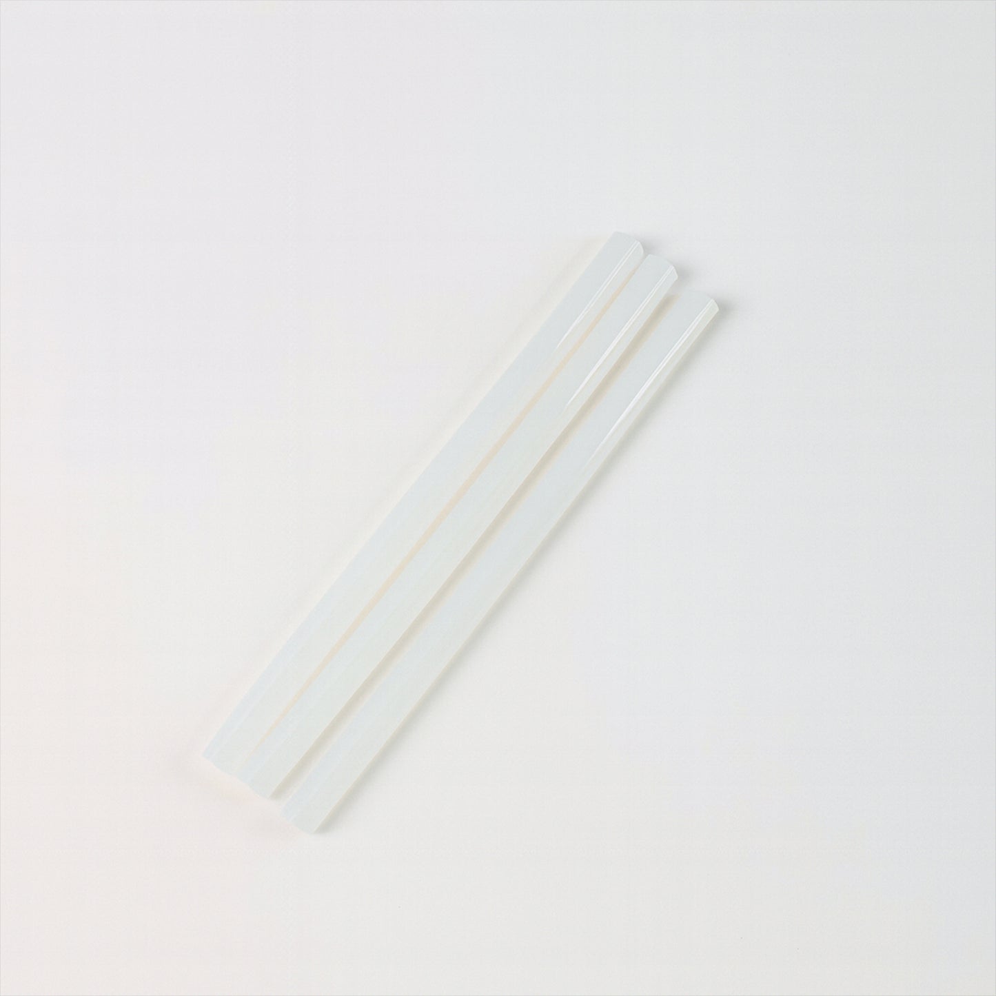 Wukusy hot melt glue sticks for glue gun, 20 cm long, ideal for home improvement projects, shown in a close-up image.