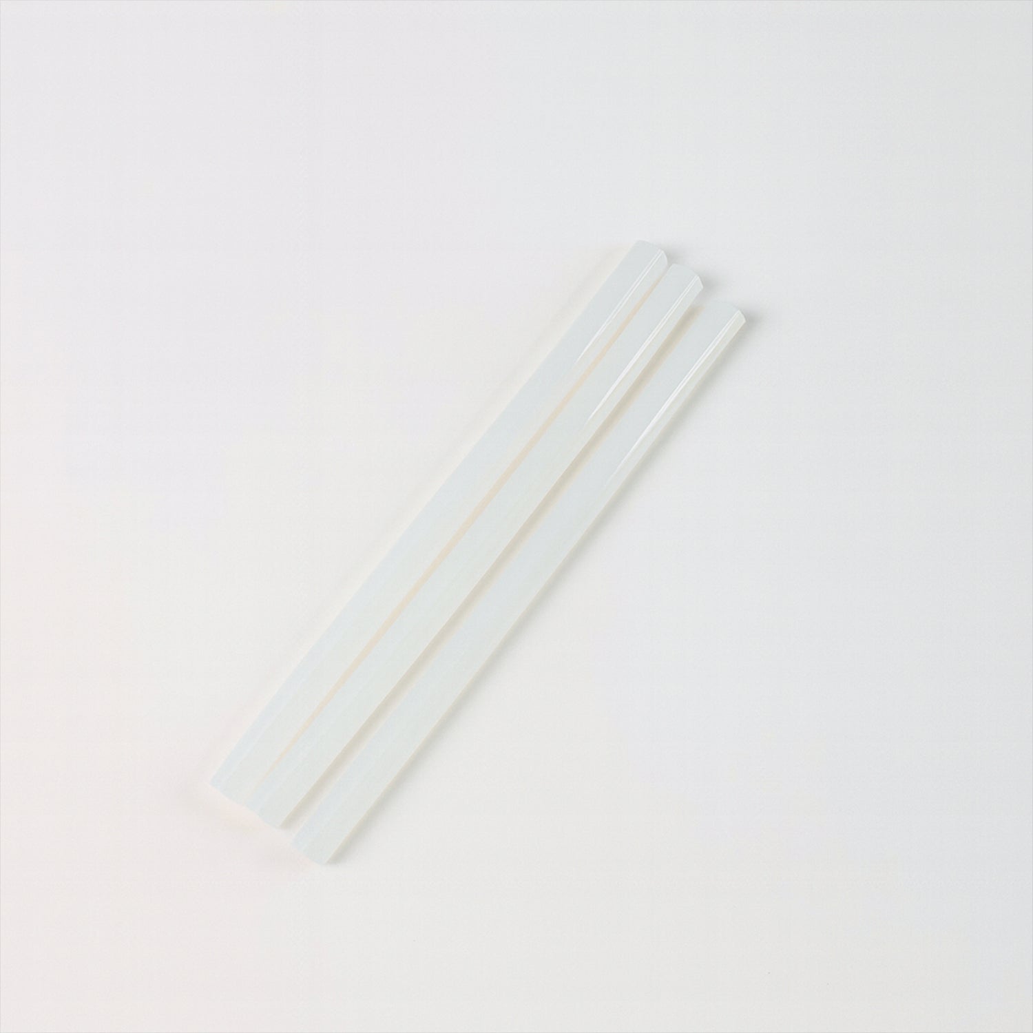 Wukusy hot melt glue sticks for glue gun, 20 cm long, ideal for home improvement projects, shown in a close-up image.