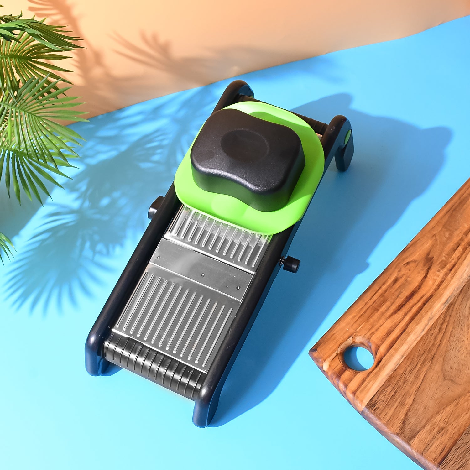 Wukusy Supermom Supreme adjustable slicer with stainless steel blades for precise vegetable and fruit slicing.
