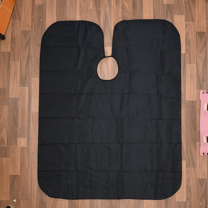 Wukusy barber hair cutting cape, single black protective cloth for hair salons and styling, shown spread out on a flat surface.