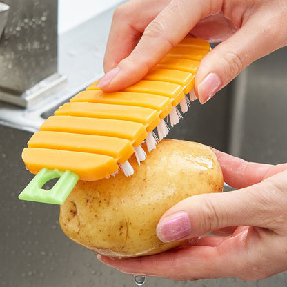 Wukusy vegetable scrubbing brush, carrot-shaped kitchen tool for cleaning potatoes, carrots, and other vegetables effectively.