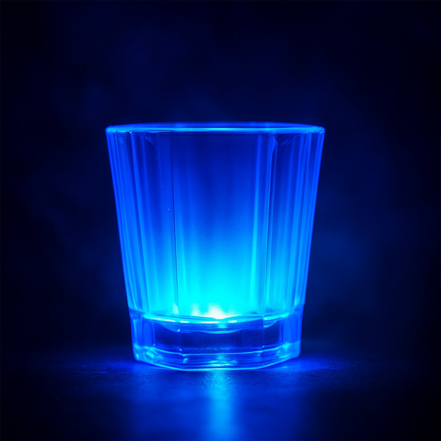 Wukusy premium LED light-up shot glass set with 24 colorful illuminated shot glasses on a display table.