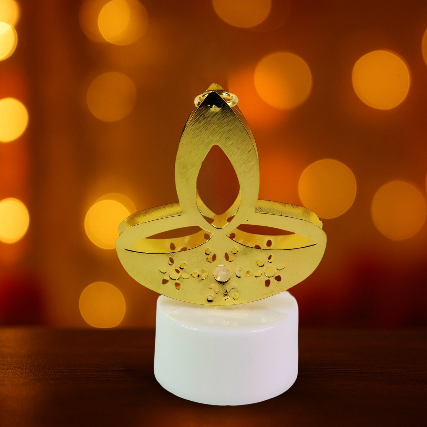 Set of 12 golden diya-shaped LED tealight candles by Wukusy, ideal for home decor with warm, glowing light.