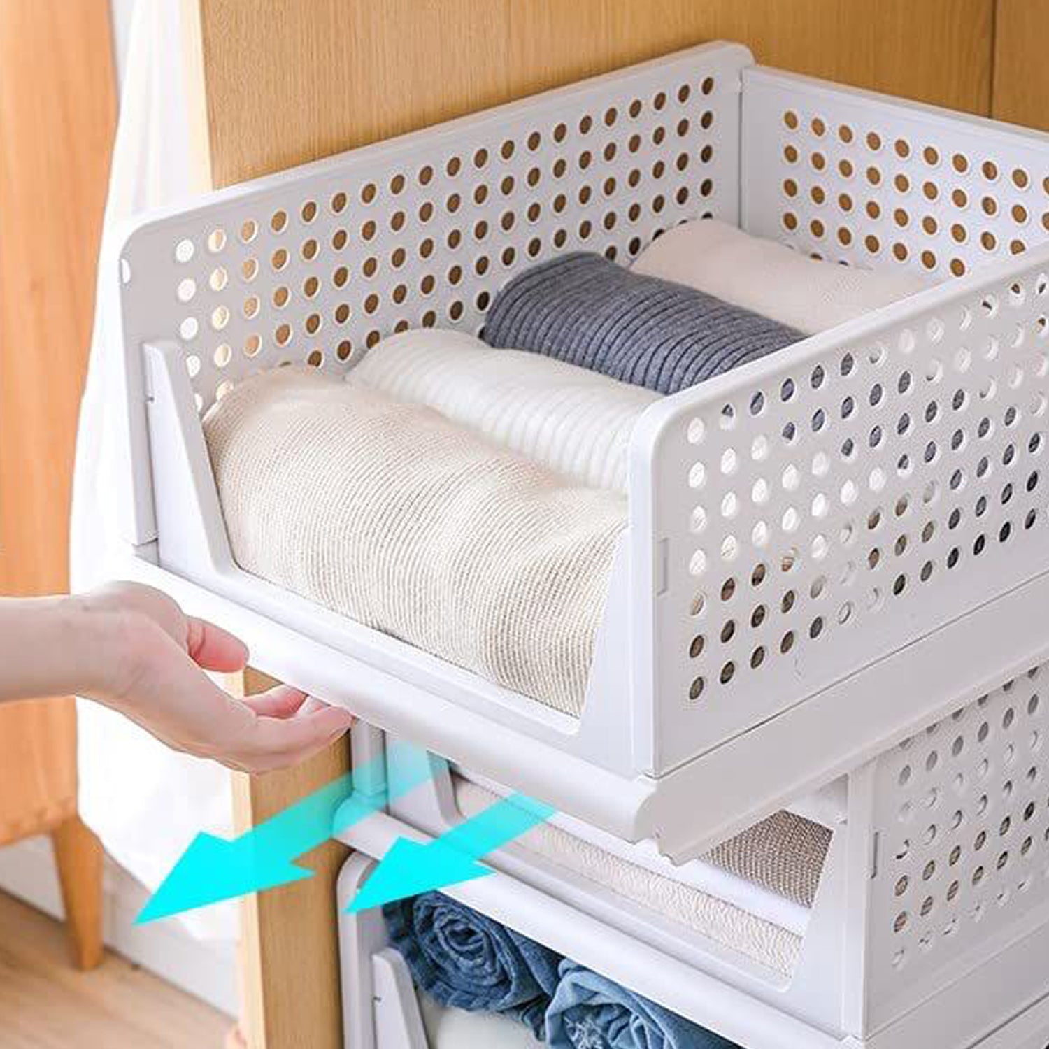 Wukusy 3-layer plastic clothes organizer with foldable, stackable drawers for wardrobe storage and closet organization.