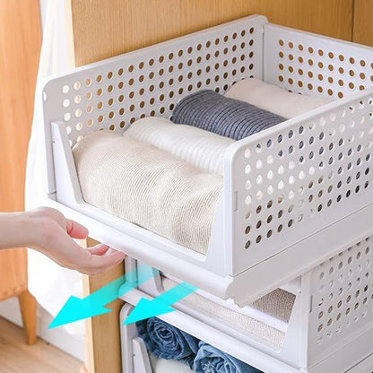 Wukusy 3-layer plastic clothes organizer with foldable, stackable drawers for wardrobe storage and closet organization.