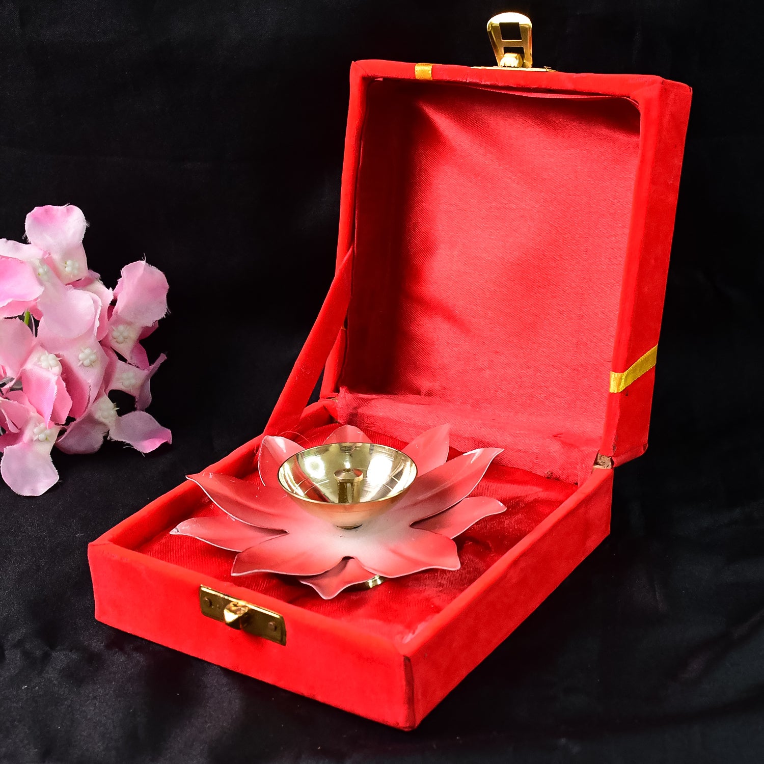 Brass lotus-shaped oil diya for home decor, featuring intricate floral design and a small bowl for oil and wick.