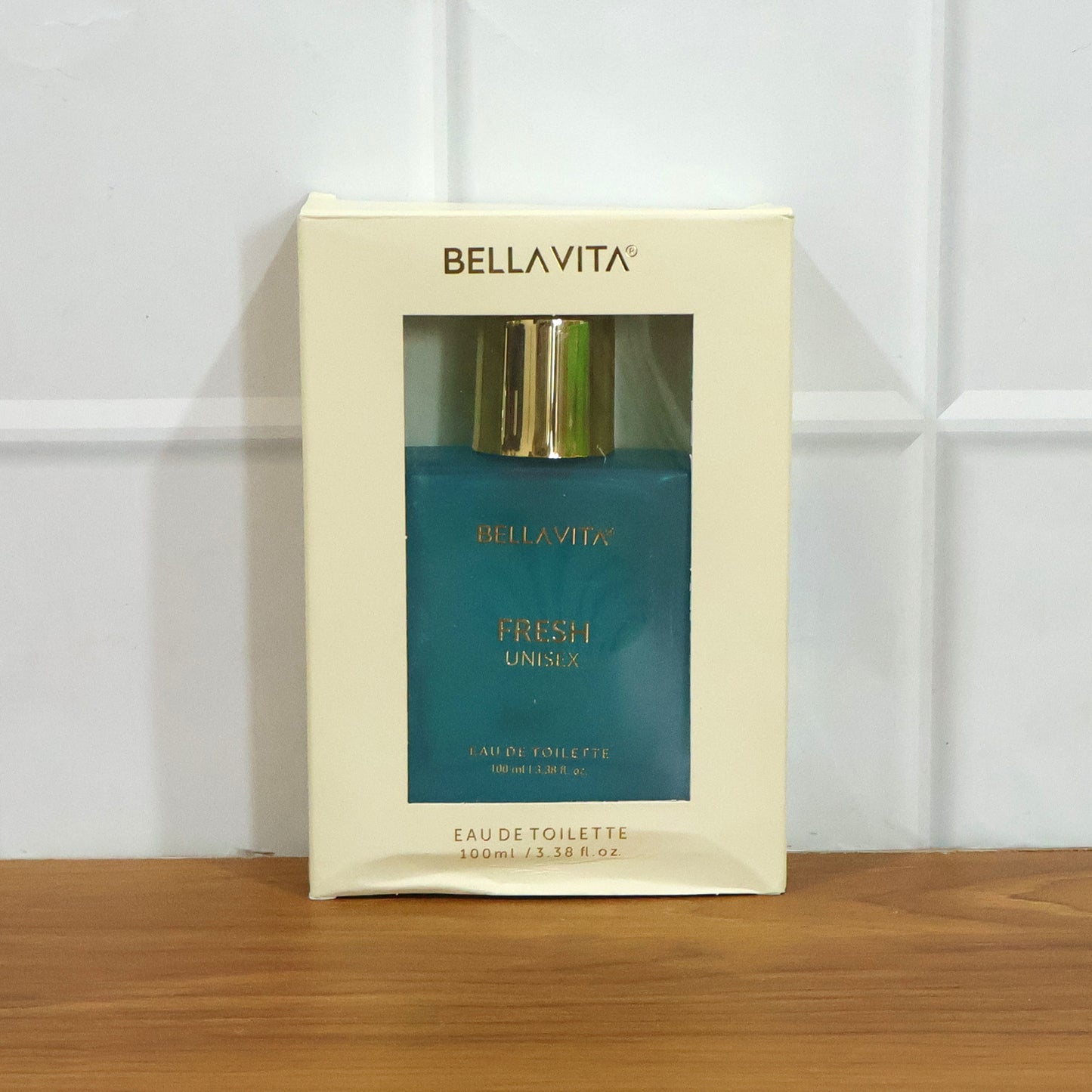 Bellavita Premium Fresh Unisex Eau De Toilette perfume bottle, 100ml, by Wukusy, with sleek transparent glass and minimalist design.