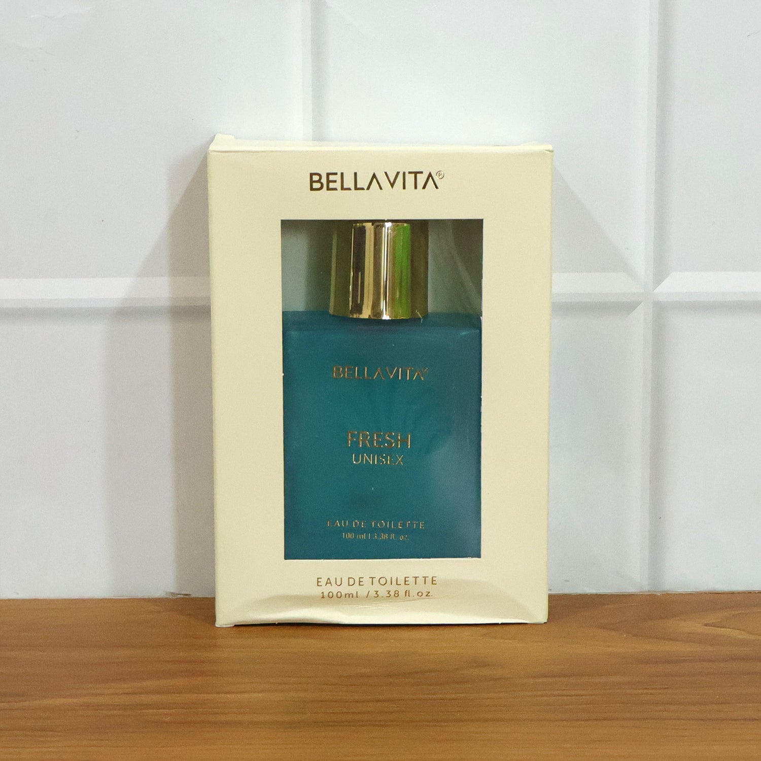 Bellavita Premium Fresh Unisex Eau De Toilette perfume bottle, 100ml, by Wukusy, with sleek transparent glass and minimalist design.