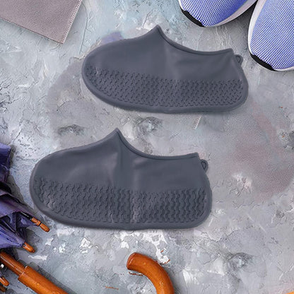 Pair of grey Wukusy silicone rain boot covers with anti-slip waterproof design, foldable and reusable for travel protection.