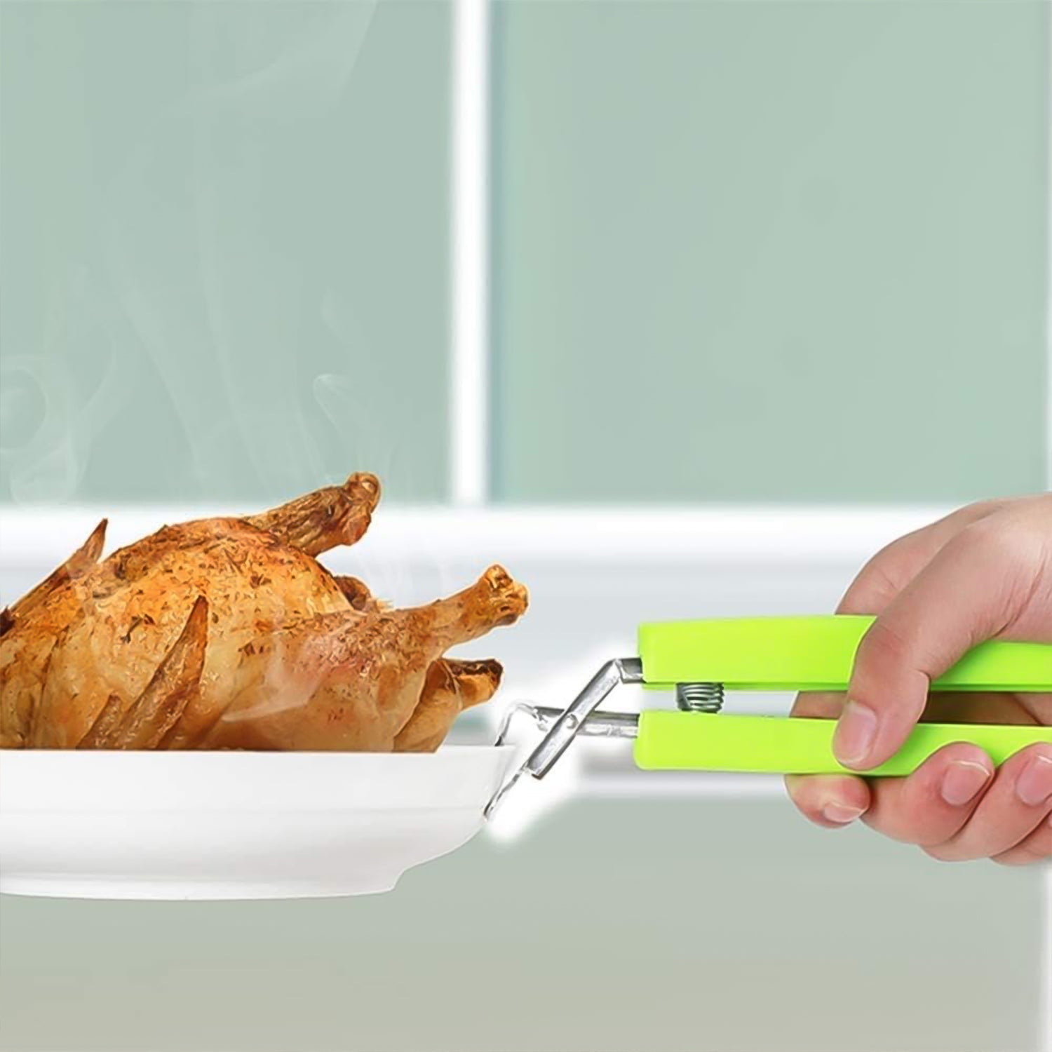 Two stainless steel bowl clips from Wukusy Kitchen Hot Plate Gripper set, designed to securely hold bowls on hot surfaces