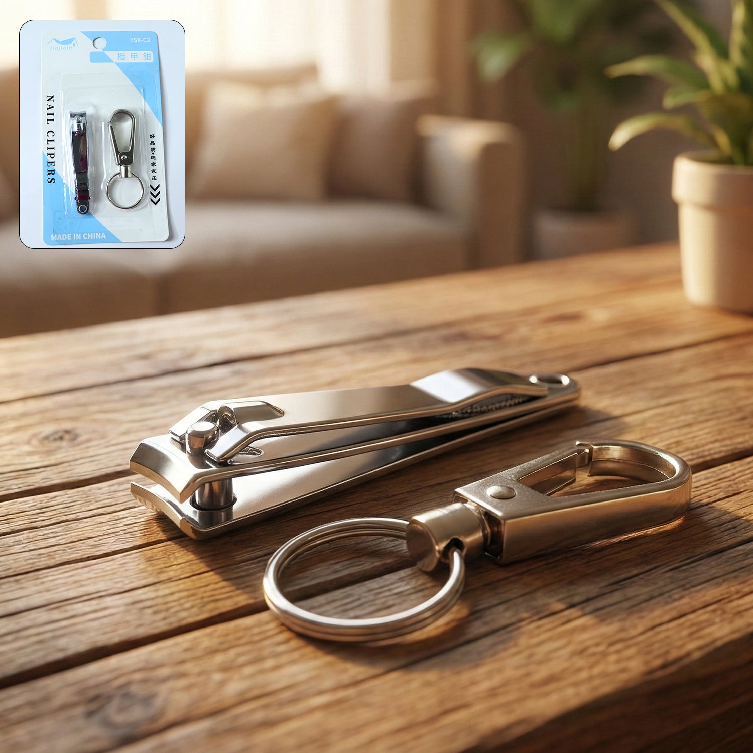 Wukusy stainless steel nail clipper set with two nail clippers and keychain holder on a white background.
