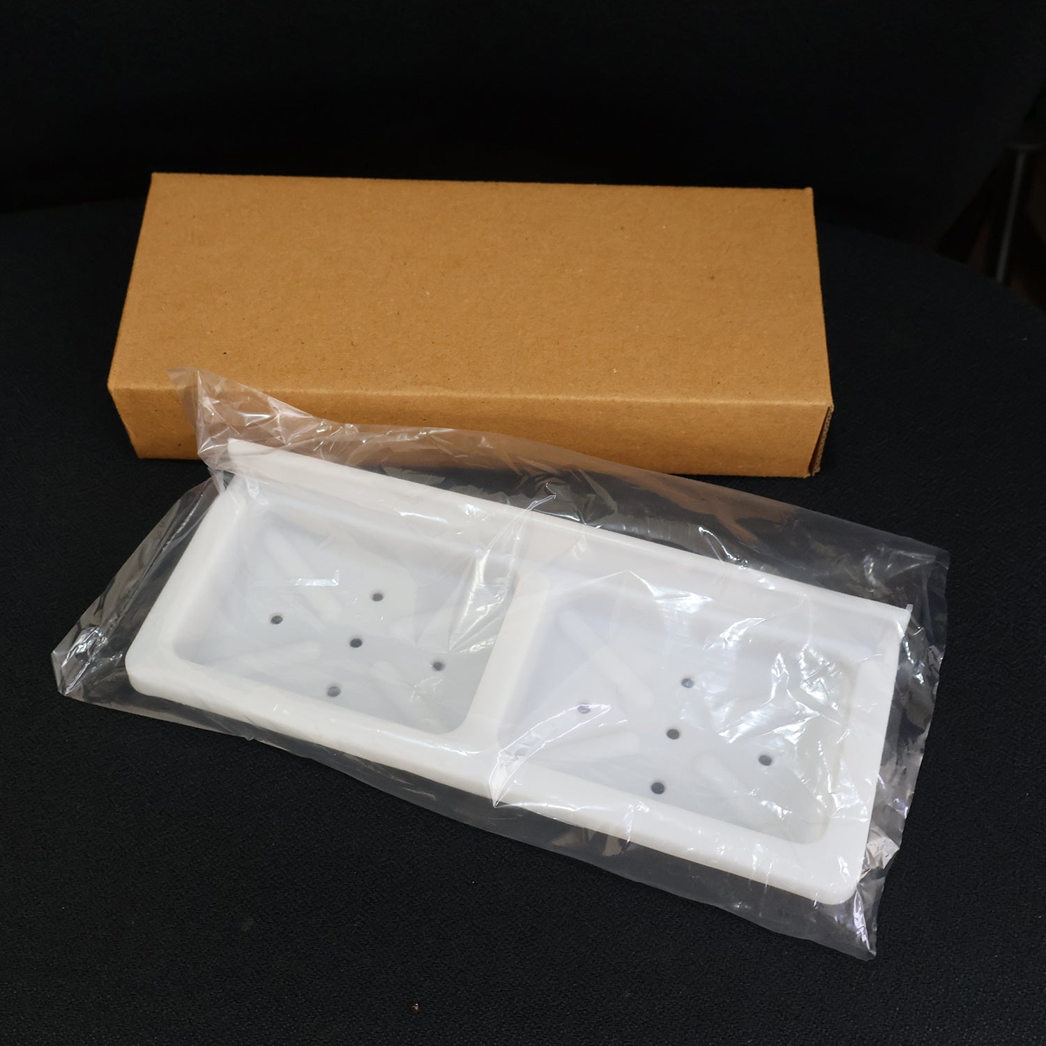 Wall mounted double compartment soap and sponge holder by Wukusy, made of durable material for bathroom or kitchen organization.