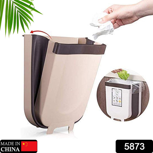 Wukusy small collapsible hanging trash can on a kitchen cabinet door, portable waste bin for bathroom, bedroom, office, or car.