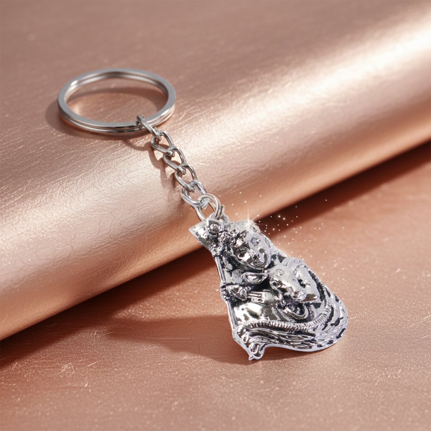 Silver-finish metal keychain with Wukusy branding, featuring a sleek and durable design, shown on a neutral background.