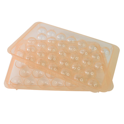 Wukusy 2486 BPA-free plastic reusable lollipop candy maker with mold and sticks for homemade lollipops in a kitchen setting.
