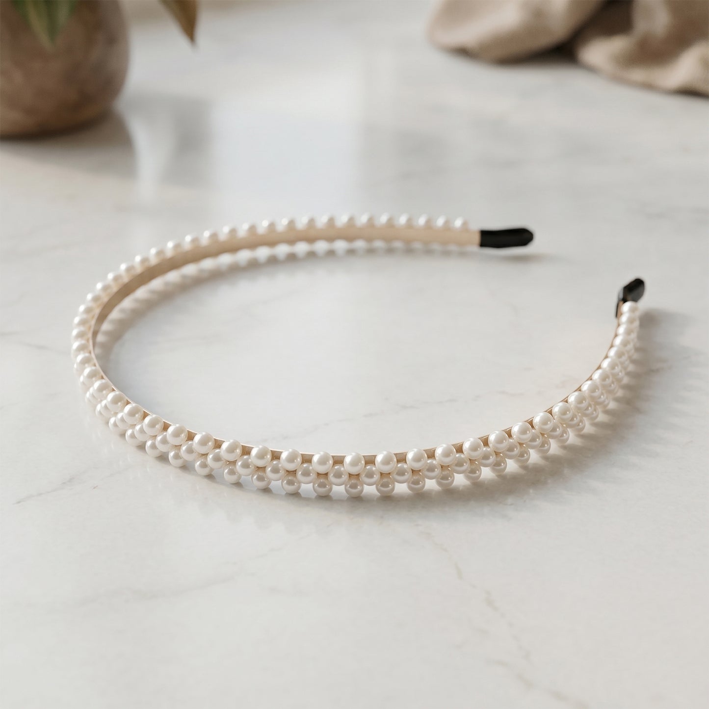 Wukusy premium pearl-embellished stylish hairband with decorative pearls and intricate design, ideal for elegant hairstyles.