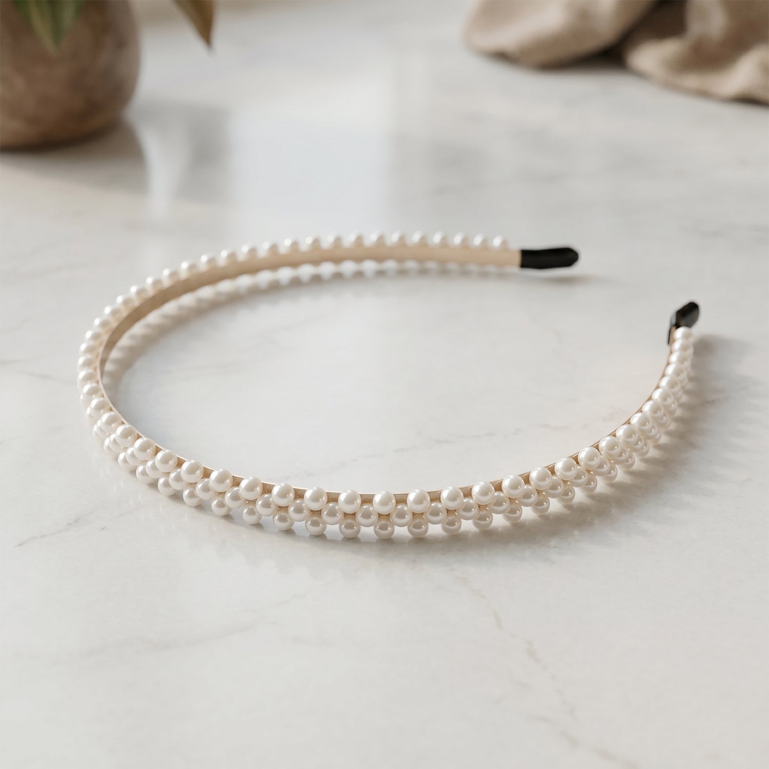 Wukusy premium pearl-embellished stylish hairband with decorative pearls and intricate design, ideal for elegant hairstyles.