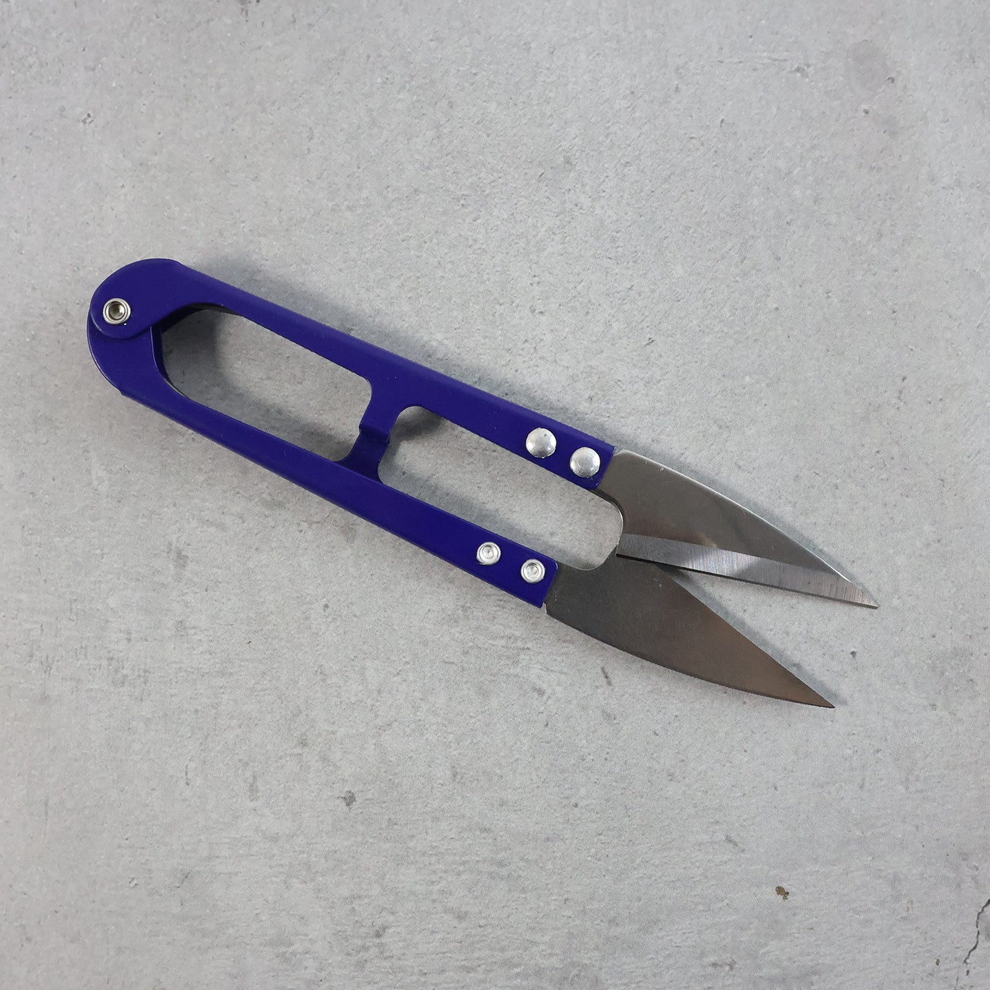 Wukusy premium sewing scissors with ergonomic handle, designed for precise cutting, shown in a home improvement setting.