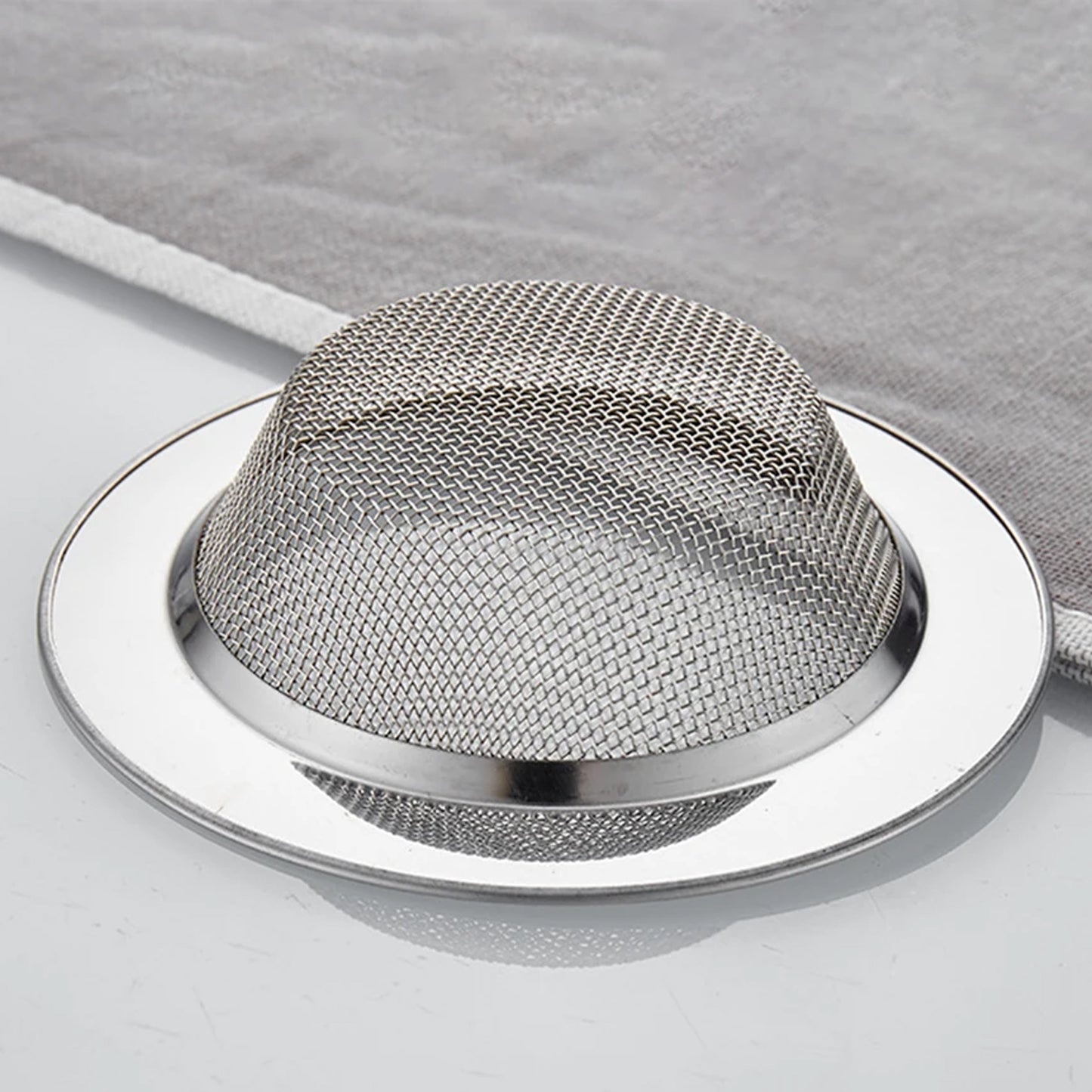 Wukusy hair catcher and sink strainer in stainless steel, designed to prevent hair and debris from clogging the drain.
